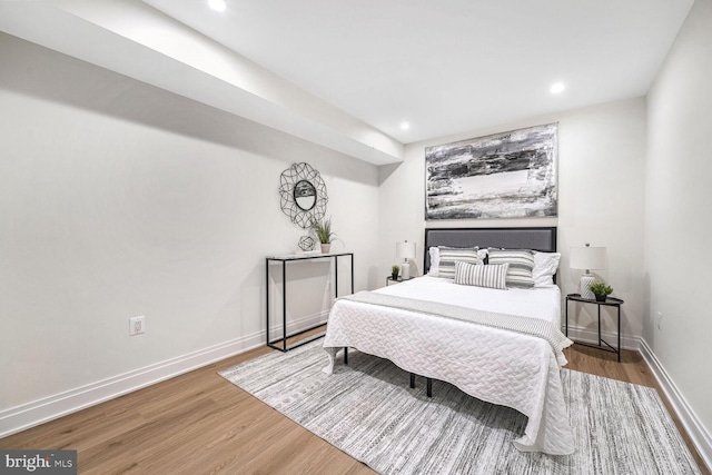 bedroom with wood-type flooring