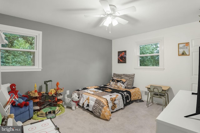 carpeted bedroom featuring ceiling fan