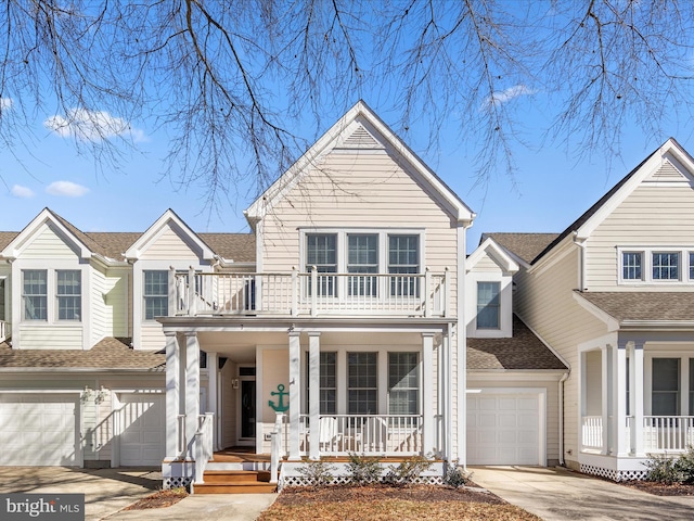 view of front of home with a garage, a balcony, and covered porch