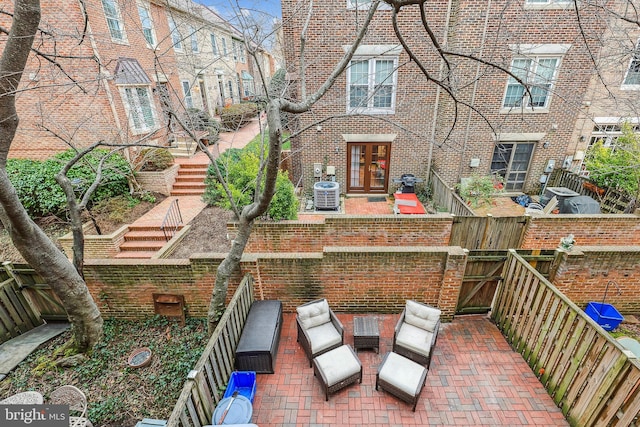 view of patio featuring central AC unit and french doors