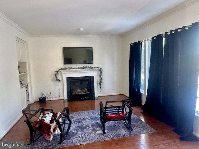 living room with crown molding and dark wood-type flooring