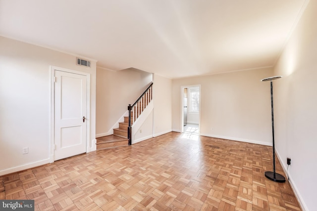 empty room with light parquet floors