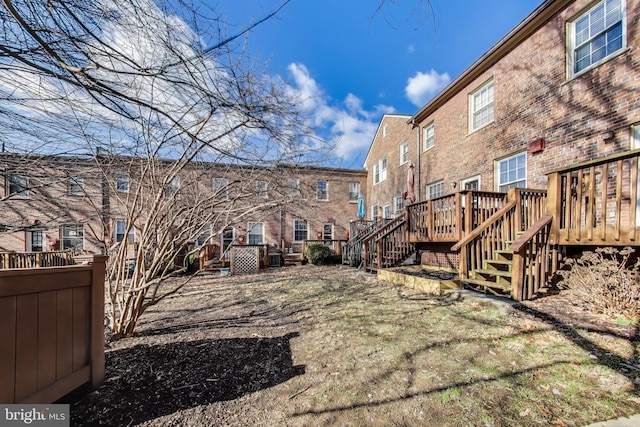 back of property with a wooden deck