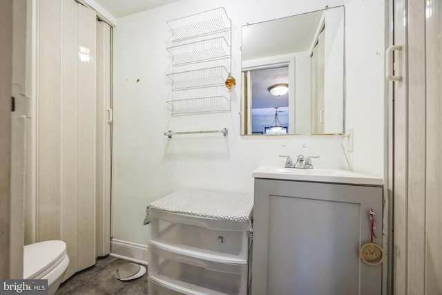 bathroom featuring vanity and toilet