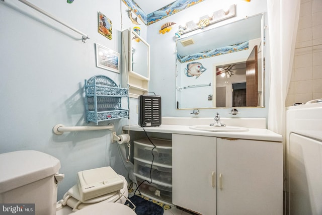 bathroom featuring vanity, ceiling fan, and toilet