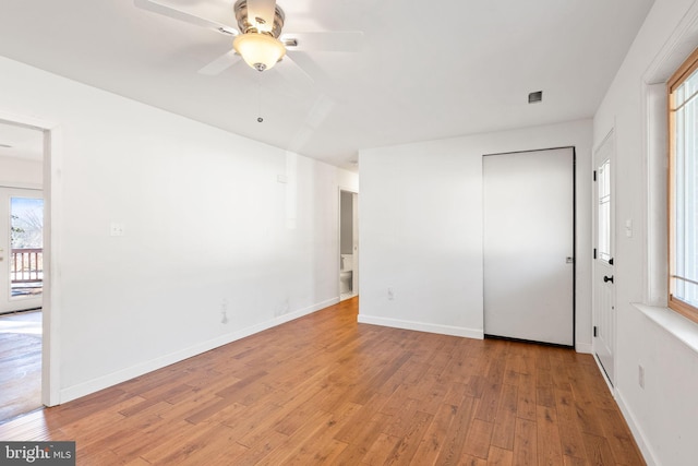 unfurnished room featuring light hardwood / wood-style flooring and ceiling fan