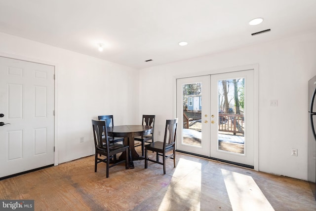 dining area featuring french doors and hardwood / wood-style floors