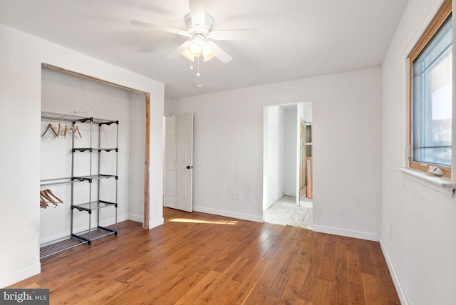 unfurnished bedroom featuring ceiling fan and light hardwood / wood-style flooring