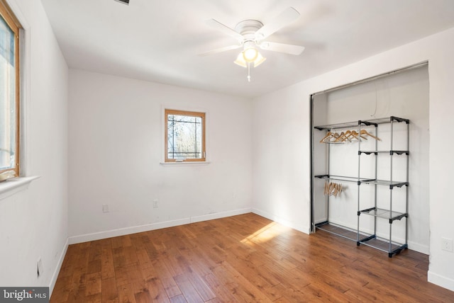 spare room featuring ceiling fan and hardwood / wood-style floors