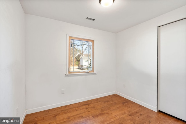 unfurnished room featuring light hardwood / wood-style flooring