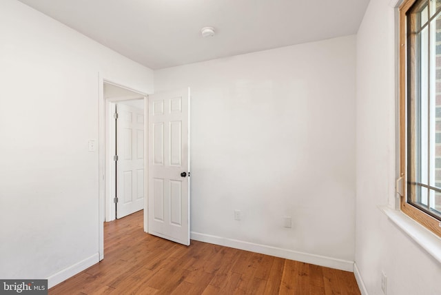 empty room with light hardwood / wood-style floors