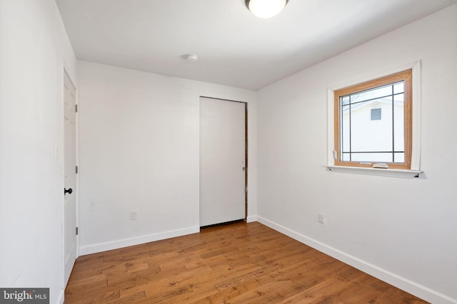 unfurnished room with light hardwood / wood-style flooring