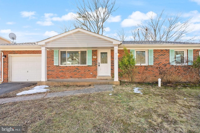 single story home featuring a garage and a front yard