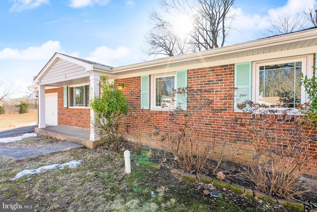 view of side of home with a garage