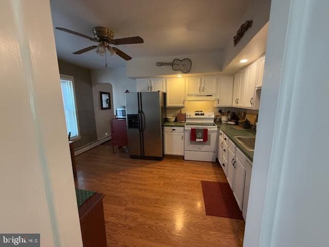 kitchen featuring a baseboard heating unit, light hardwood / wood-style floors, white cabinets, and appliances with stainless steel finishes