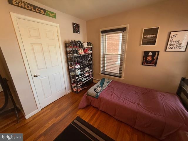 bedroom featuring dark hardwood / wood-style floors