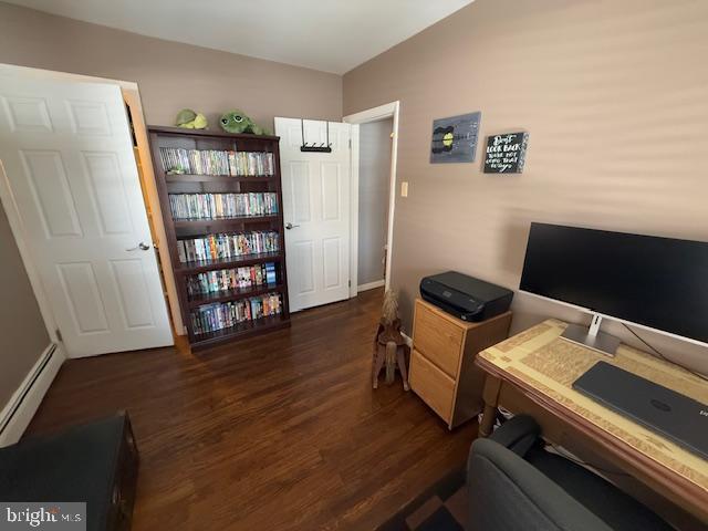 office area featuring a baseboard radiator and dark hardwood / wood-style floors