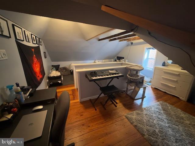 office featuring wood-type flooring and vaulted ceiling