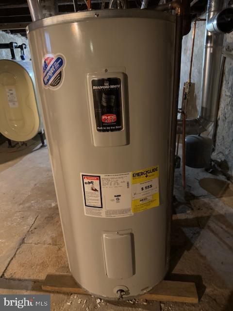 utility room with electric water heater