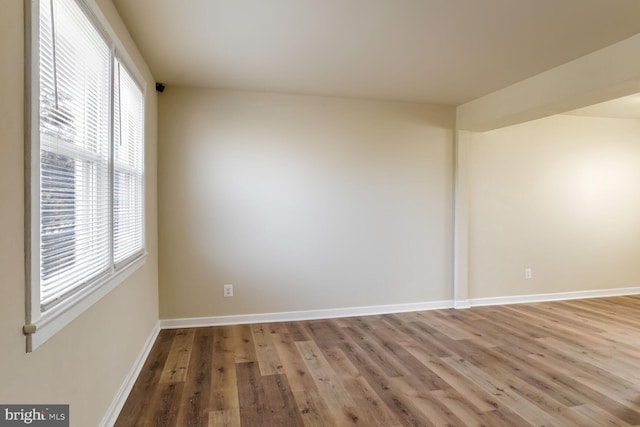 empty room with light hardwood / wood-style floors