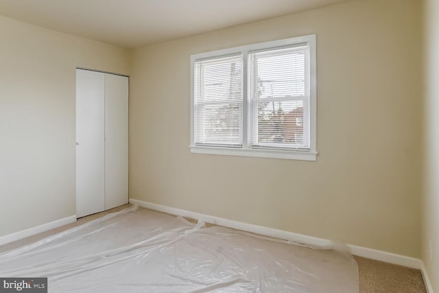 unfurnished bedroom with a closet