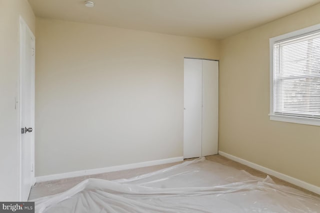 unfurnished bedroom featuring a closet