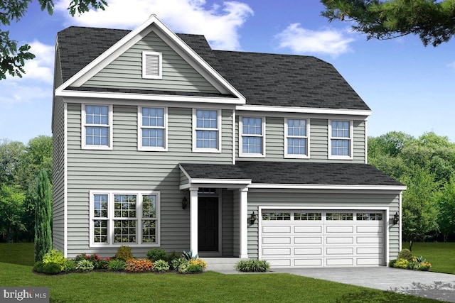 view of front of house featuring a garage and a front yard