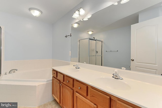 bathroom with shower with separate bathtub and vanity