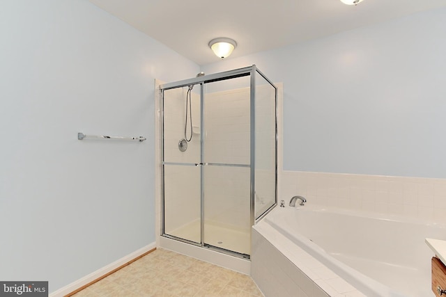 bathroom featuring vanity and plus walk in shower