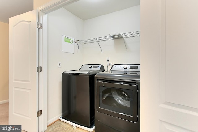 laundry area featuring washing machine and clothes dryer