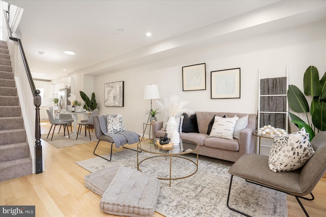 living room with light hardwood / wood-style flooring