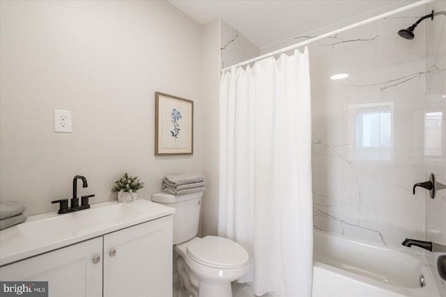 full bathroom featuring toilet, vanity, and shower / bathtub combination with curtain