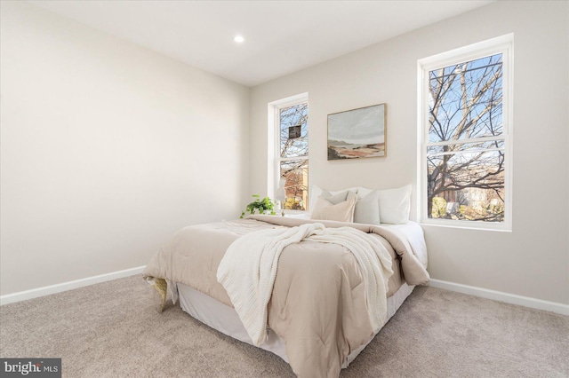 bedroom featuring light carpet