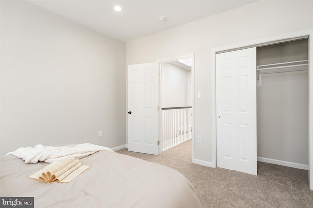 carpeted bedroom with a closet