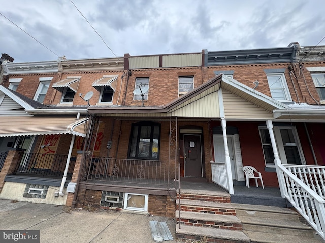 view of property featuring a porch