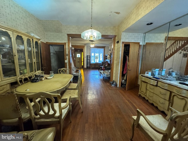 dining area featuring dark wood-type flooring and ceiling fan