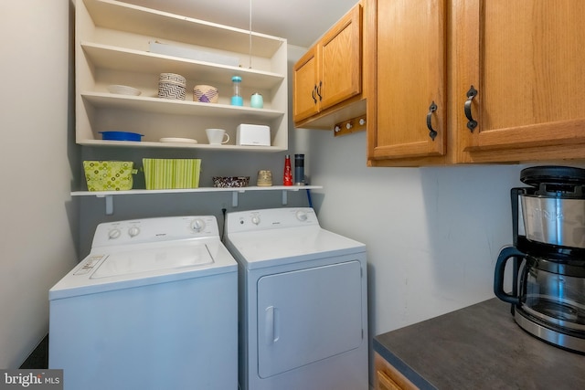 laundry area with cabinets and washing machine and dryer