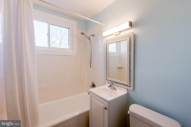 full bathroom with vanity, shower / tub combo with curtain, and toilet