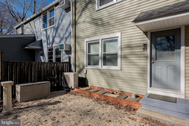 view of exterior entry featuring ac unit