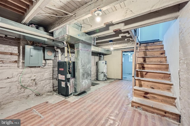 basement featuring water heater, heating unit, and electric panel