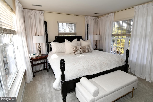 bedroom featuring light carpet