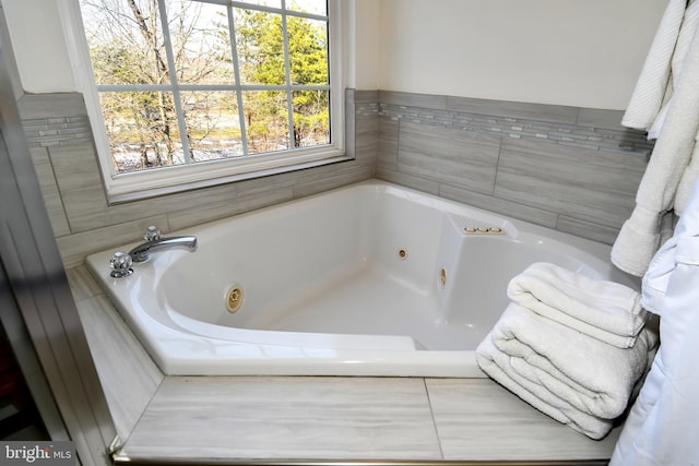 bathroom with tiled bath