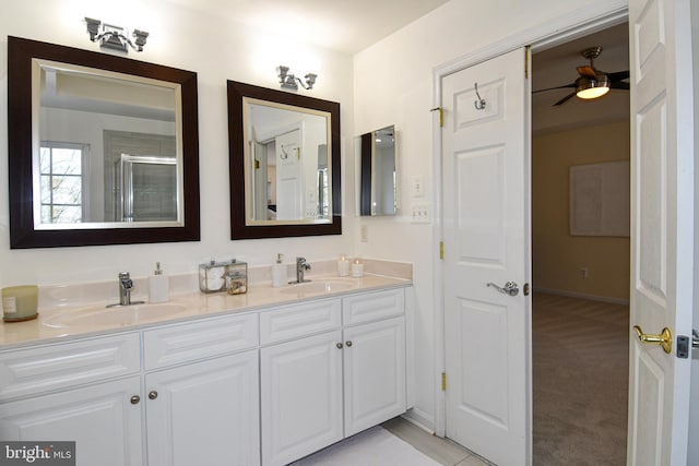 bathroom featuring vanity and a shower with shower door