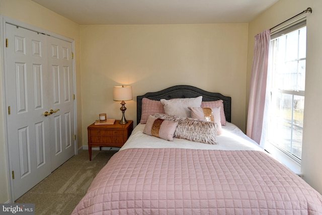 bedroom featuring light colored carpet