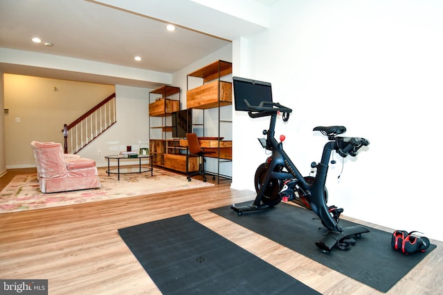 workout room with hardwood / wood-style floors