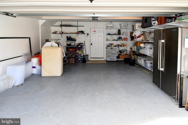 garage featuring a garage door opener and high end refrigerator