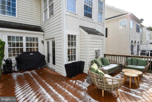 snow covered deck with a grill and outdoor lounge area