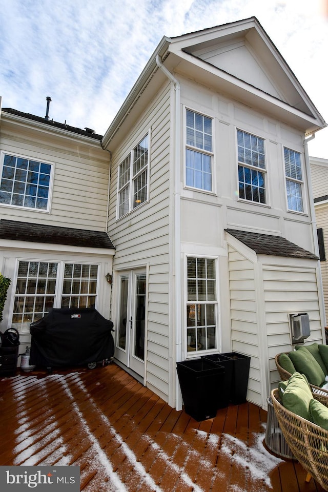 exterior space with a deck and french doors