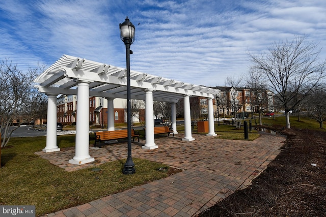 view of patio with a pergola and a playground