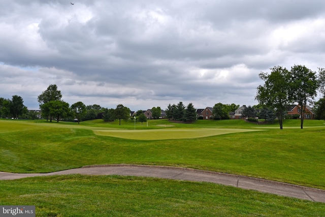 view of property's community featuring a lawn